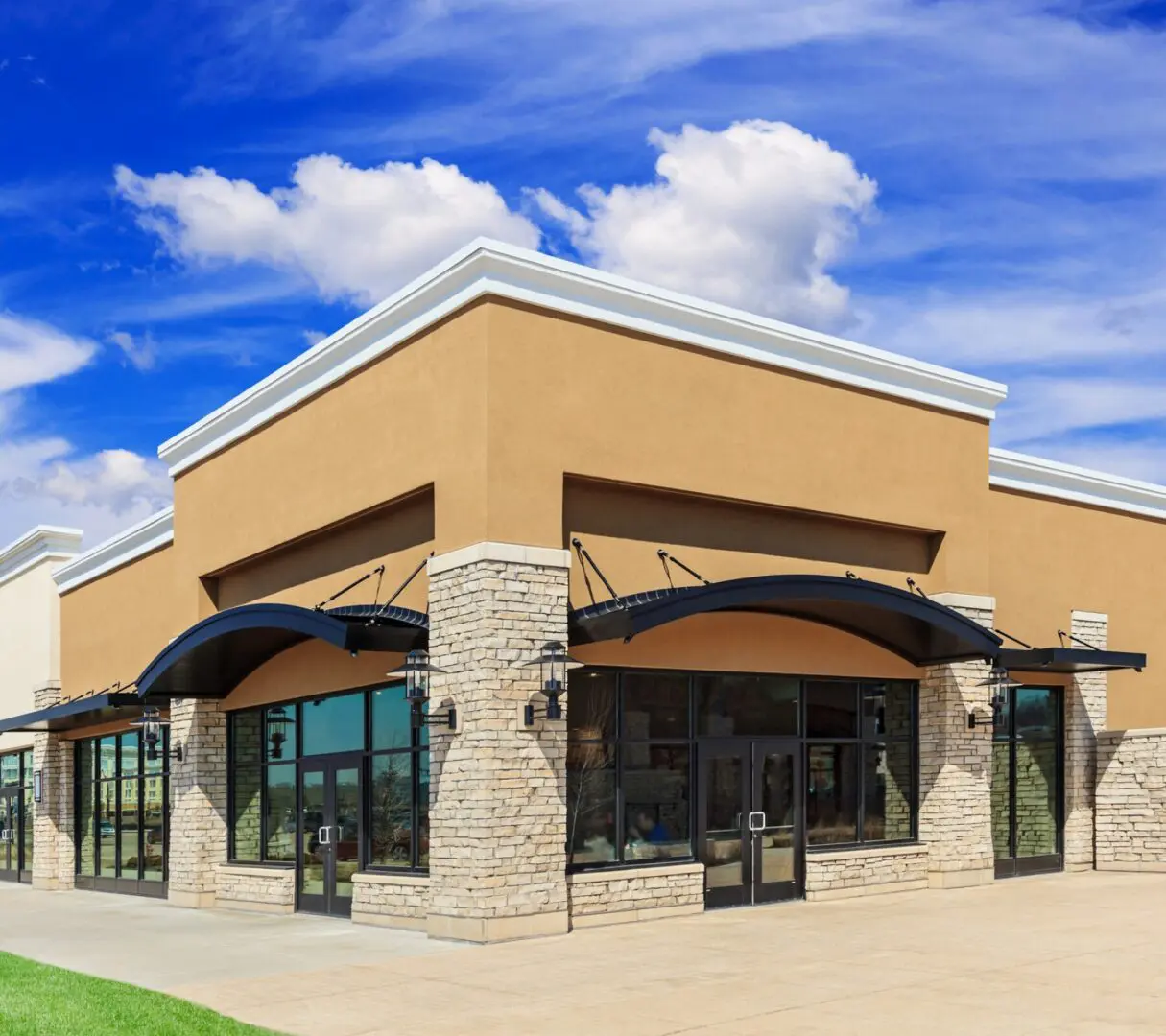 Modern commercial building with stone facade.